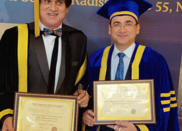 Dr. Lalit Arora holding his award certificate