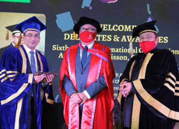 Award ceremony with delegates in academic robes
